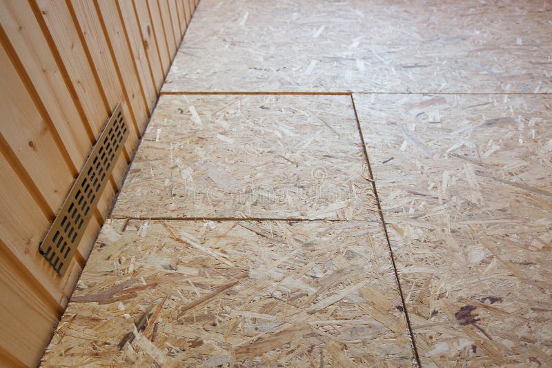 OSB boards flakeboards laid on floor. As preparation for installing parquet. Professional work, DIY, home improvement and renovation, carpentry concept royalty free stock images